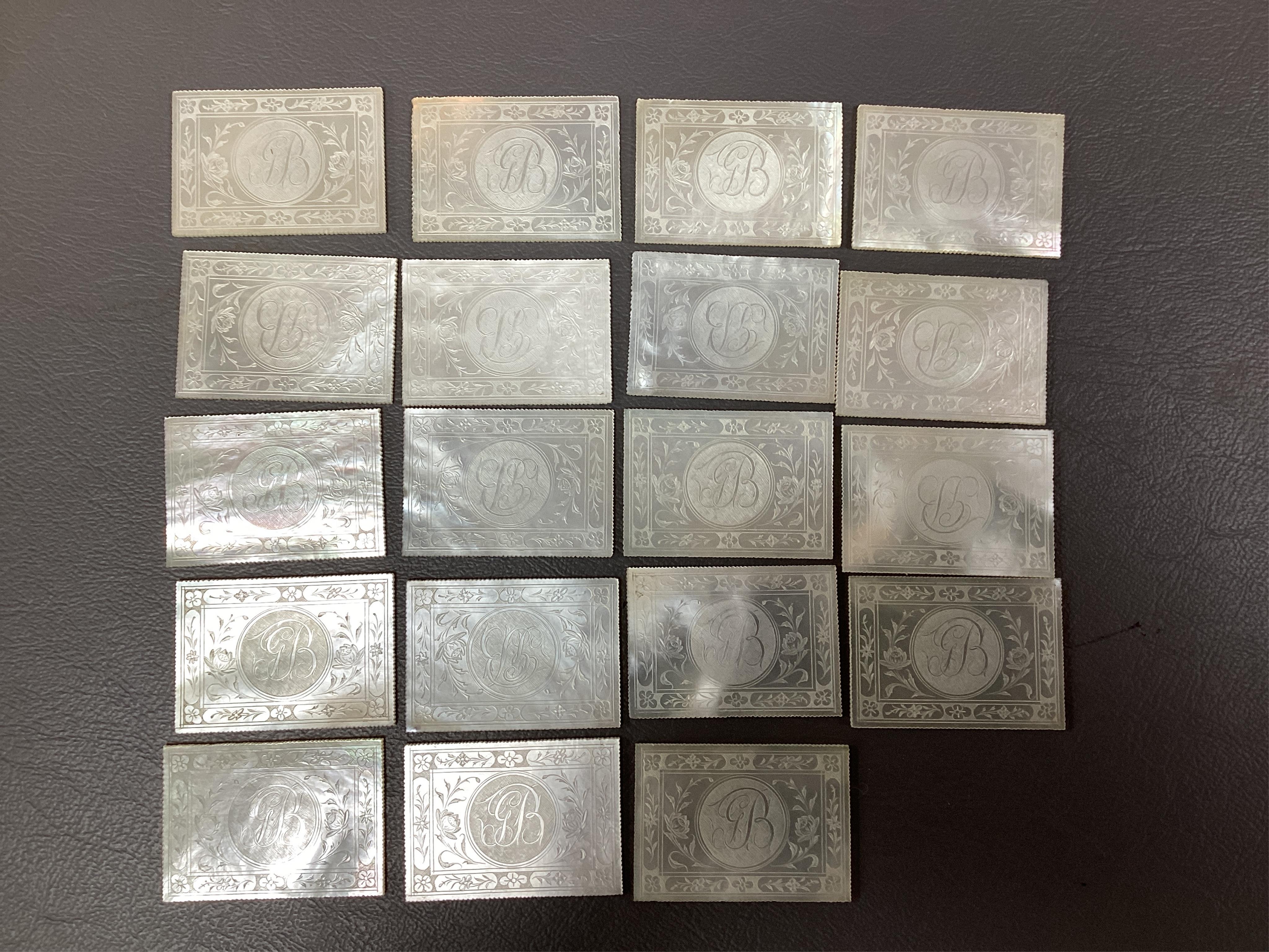 Two Chinese gilt decorated black lacquer games boxes, containing numerous mother-of-pearl counters, 19th century